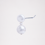 A side view of an Onomatpee Pokopoko 3-pearl stud earring, featuring two larger freshwater pearls, a small pearl in the center, and silver post. Available at NiMi Projects UK.