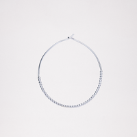 A small Onomatopee sivler Puchipuchi Hoop Earrings, featuring a row of tiny dots along the bottom section of the hoop and 3 cm in diameter. Available at NiMi Projects UK.