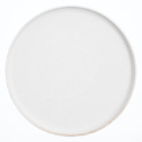 A large, round Kihon no Utsuwa white, Japanese dinner porcelain plate. Made in Japan from recycled ceramics and local clays and available at NiMi Projects UK.