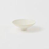 A Kihon no Utsuwa porcelain rice bowl or side dish in creamy white, featuring a small platform base. Made in Japan and available at NiMi Projects UK.