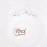 A closeup of the Japan Toyo Glassware label on the base of a small vintage decadon shaped glass on show at NiMi Projects UK.