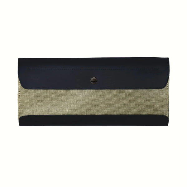 A top view of a Postalco Tool Box pen case, featuring a navy blue, soft, cowhide leather top with metal snap clasp and a central mint green, cotton canvas central panel.