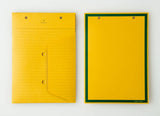 An top view of two Postalco Snap Pocket envelopes in mustard yellow, featuring holes at the top to attach to a Snap Pad. One side is lined and features the Postalco bird logo at the top, the other side is plain yellow with a dark green border.