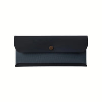 A Postalco Snap Pen Case with a navy blue soft, cow-hide top with metal snap clasp and matching navy blue cotton textile central section.