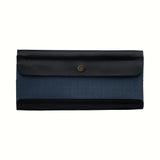 A Postalco Tool Box pen case, featuring a navy blue, soft, cowhide leather top with metal snap clasp and a central navy blue panel of cotton canvas.