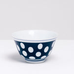 A vintage blue Japanese Arita porcelain rounded teacup with white dots, available at NiMi Projects UK