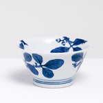 A NiMi Projects vintage large Japanese porcelain bowl featuring a design of acorns and leaves in blue on white.