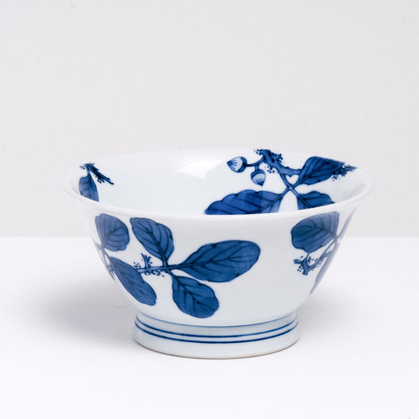 A NiMi Projects vintage large Japanese porcelain bowl featuring a design of acorns and leaves in blue on white.